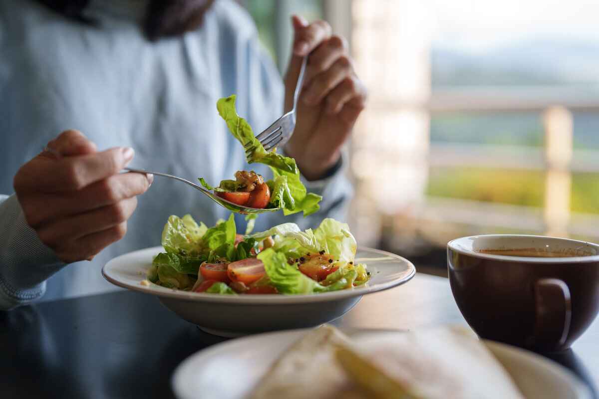 Woman eating salad
