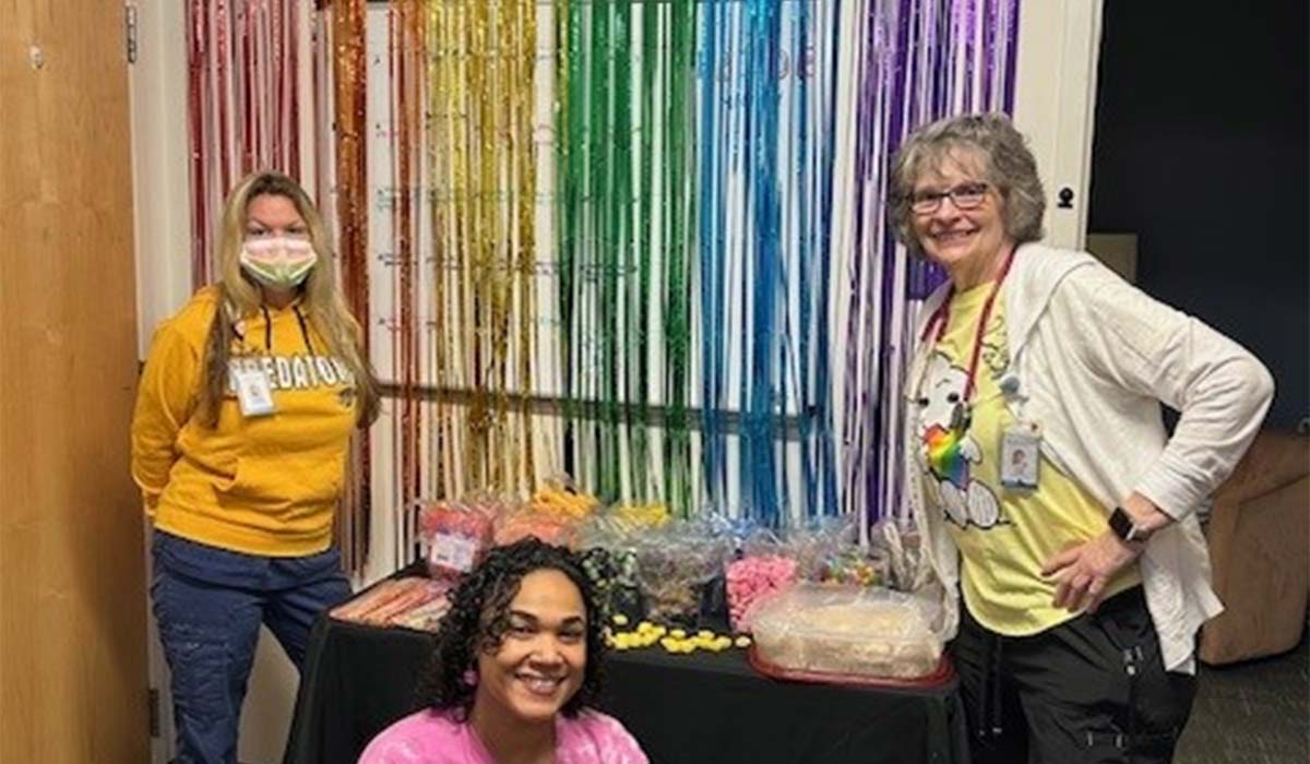 Among those marking Pride Month at a colorful candy display were NEMG medical assistants